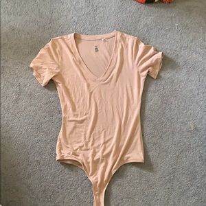 baby pink body suit